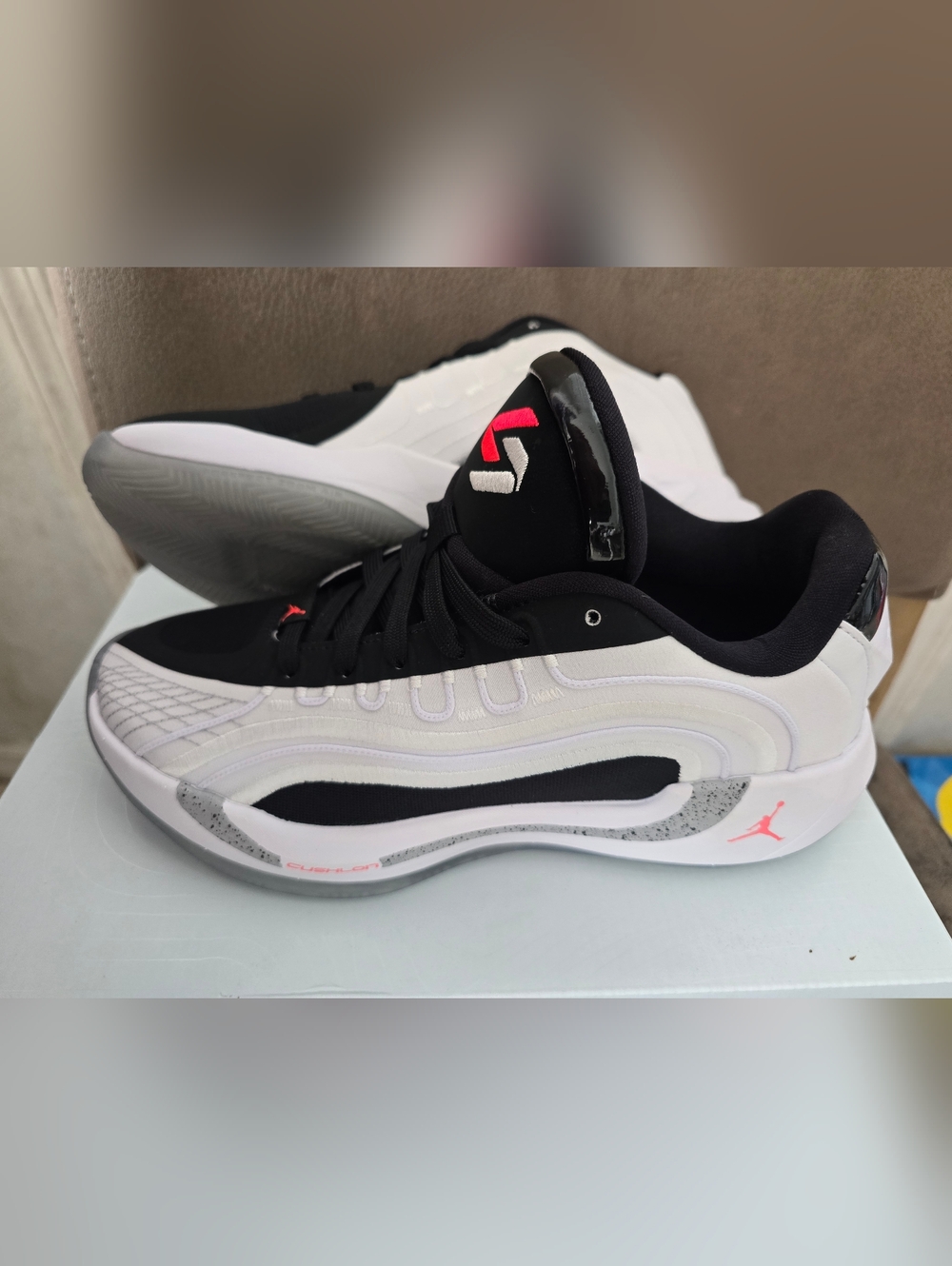 Jordan Women's White and Black Athletic Sneakers with Pink Accents